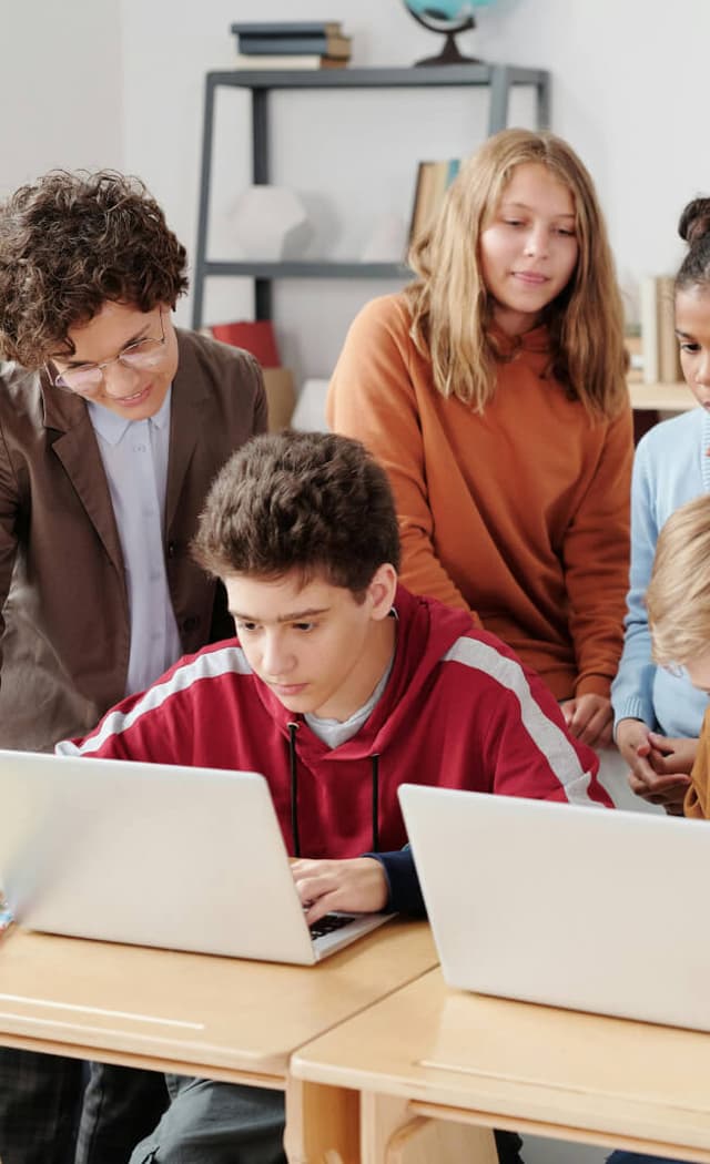 Students learning with laptops